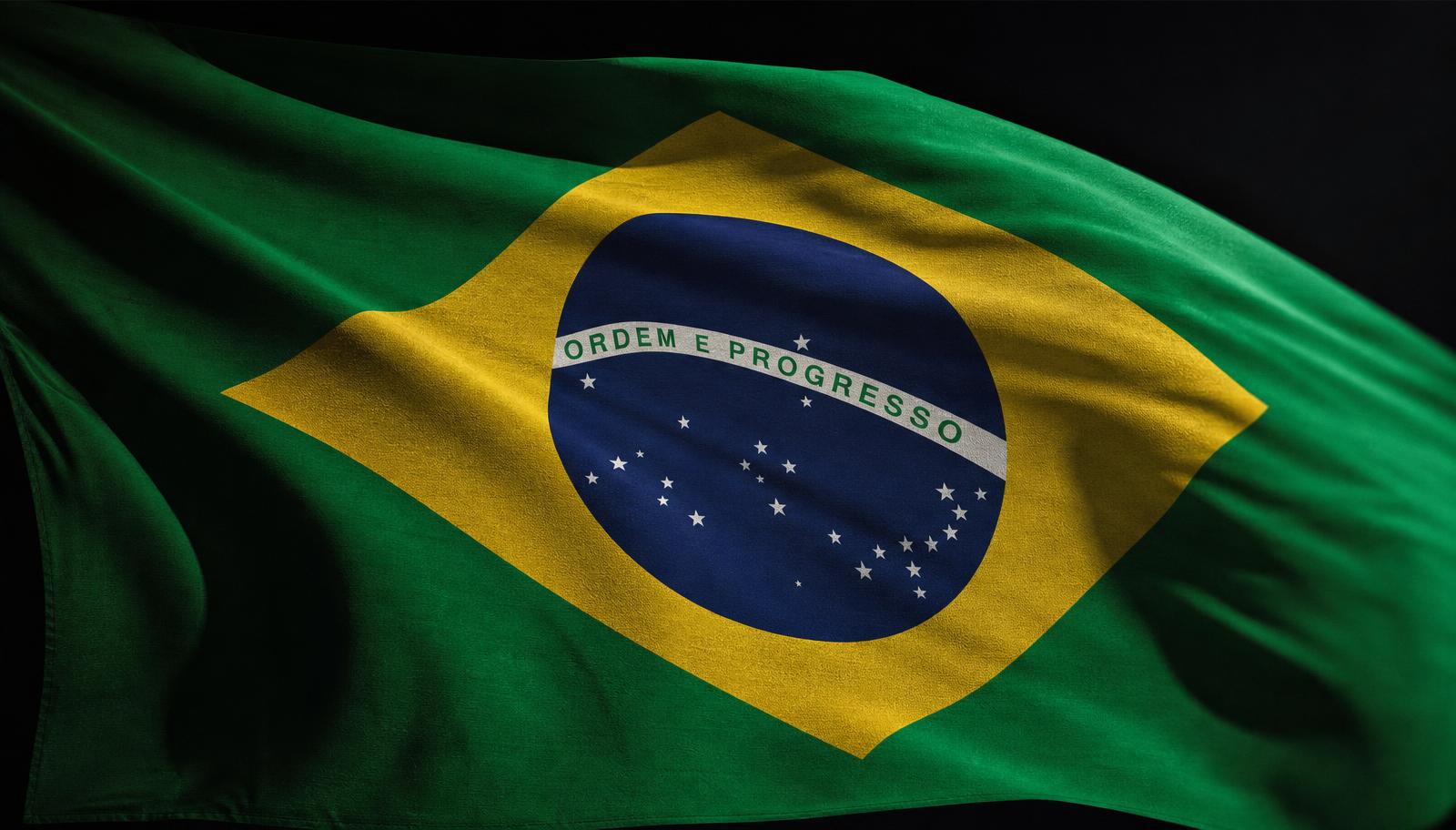 Bandeira do Brasil iluminada sobre fundo escuro